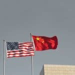 USA and China flags. Trade war economy conflict tax business finance money / United States vs China.