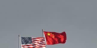 No One Wins in a US-China Trade War USA and China flags. Trade war economy conflict tax business finance money / United States vs China.