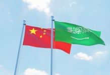 China’s Latest Diplomatic Move Will Extend Its Trade, Energy, Financial and Maritime Power Saudi Arabia and China, two flags waving against blue sky