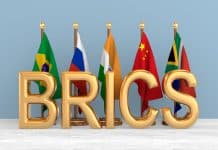 South Africa Walks a Tightrope of International Alliances – It Needs Russia, China and the West Set flags BRICS in room. 3D illustration